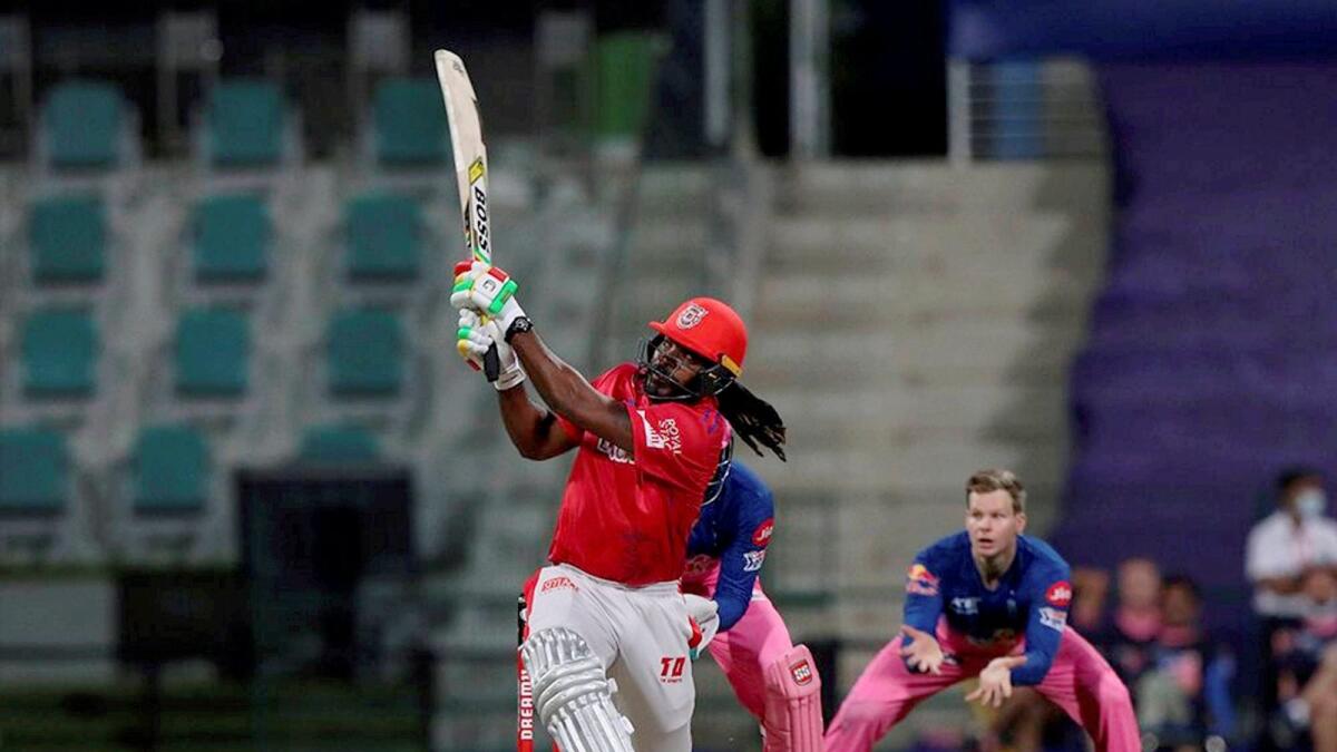 Chris Gayle plays a shot during the IPL match against Rajasthan Royals. — PTI