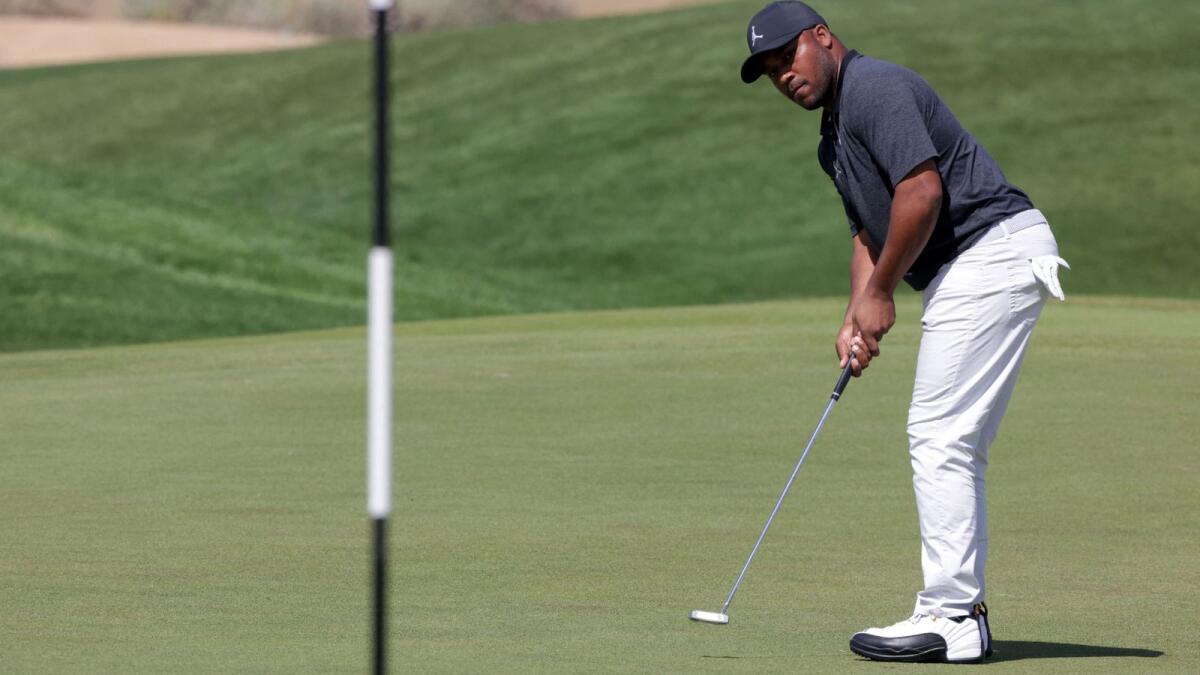 Harold Varner III of the US putts during the third round of the Saudi International on Saturday. — AFP