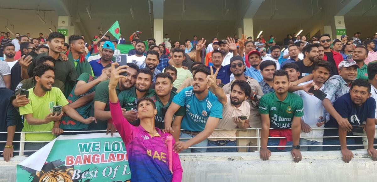 UAE batter Dhruv Parashar takes a selfie with fans after the final. — Rituraj Borkakoty