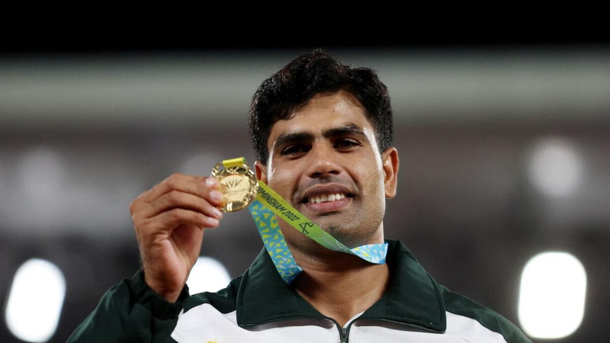 Gold medallist Pakistan's Arshad Nadeem celebrates on the podium. — Reuters