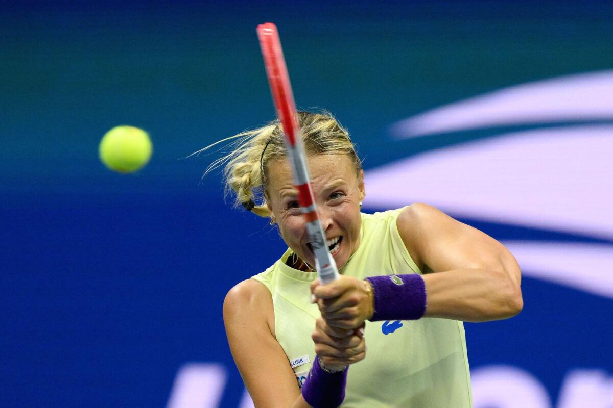Anett Kontaveit hits a return to Serena Williams during their 2022 US Open second round match. (AFP)