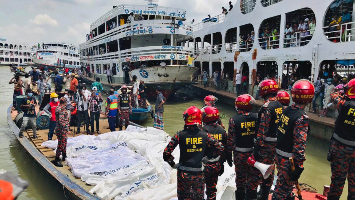 A ferry carrying about 100 passengers capsized after being hit on Monday by a larger vessel in a Bangladeshi river, killing at least 30 people. Photo: AP