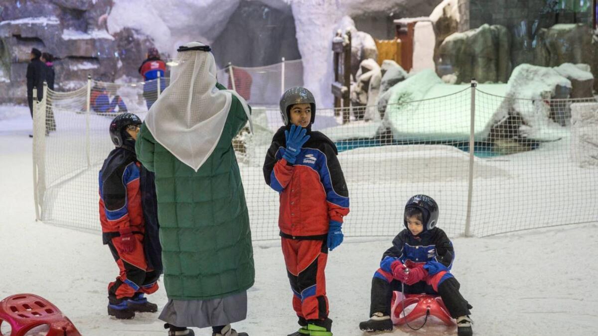People enjoying themselves at Ski Dubai, located in Mall of the Emirates.- Alamy Image