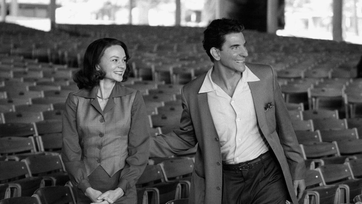 Carey Mulligan as Felicia Montealegre, left, and Bradley Cooper as Leonard Bernstein in a scene from 'Maestro'