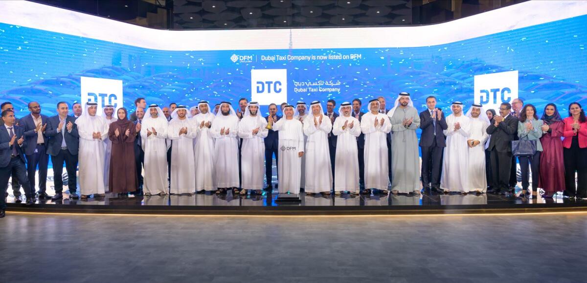 Abdul Muhsen Ibrahim Kalbat, chairman, board of directors, DTC, and Mansoor Rahma Alfalasi, chief executive officer, DTC, rang the DFM market opening bell to celebrate the listing, in the presence of Helal Al Marri, chairman of DFM, and Hamed Ali, CEO of DFM and Nasdaq Dubai, alongside several other officials. — Supplied photo