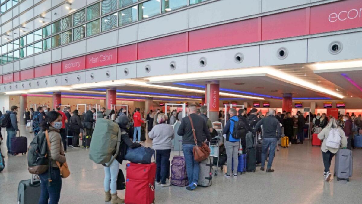 Passengers at ondon Heathrow Airport. — AP