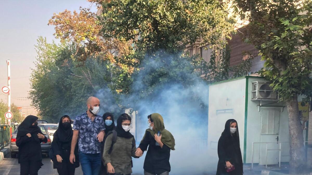 Tear gas is fired by security forces to disperse protestors in front of the Tehran University, Iran.  –AP