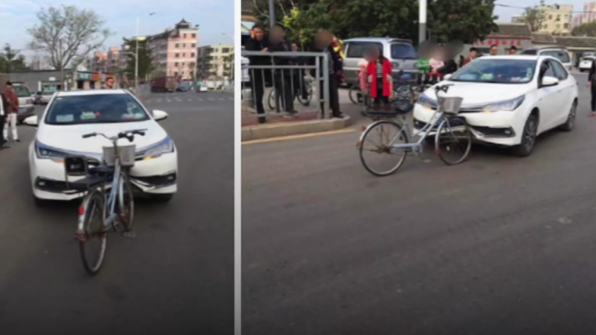 Car damaged by bicycle after collision in viral photo