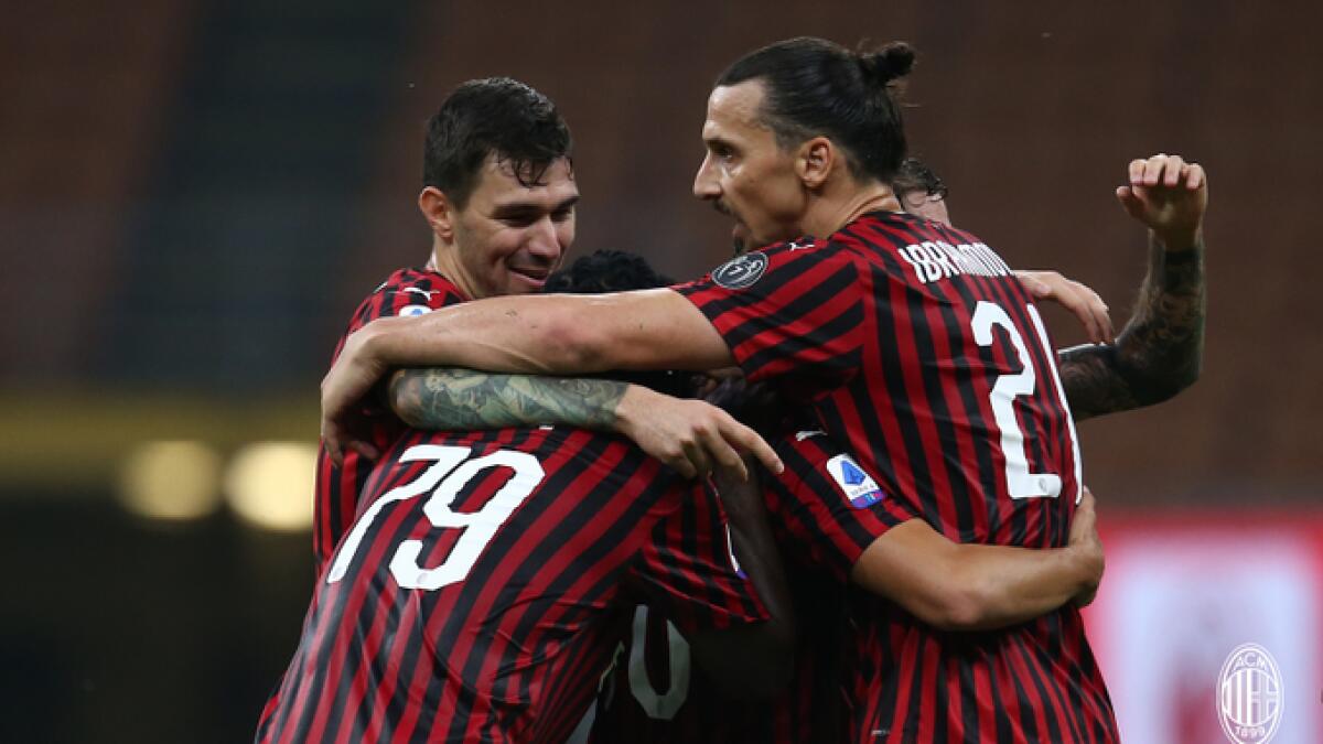 AC Milan players celebrate after defeating Parma on Wednesday. - (AC Milan Twitter
