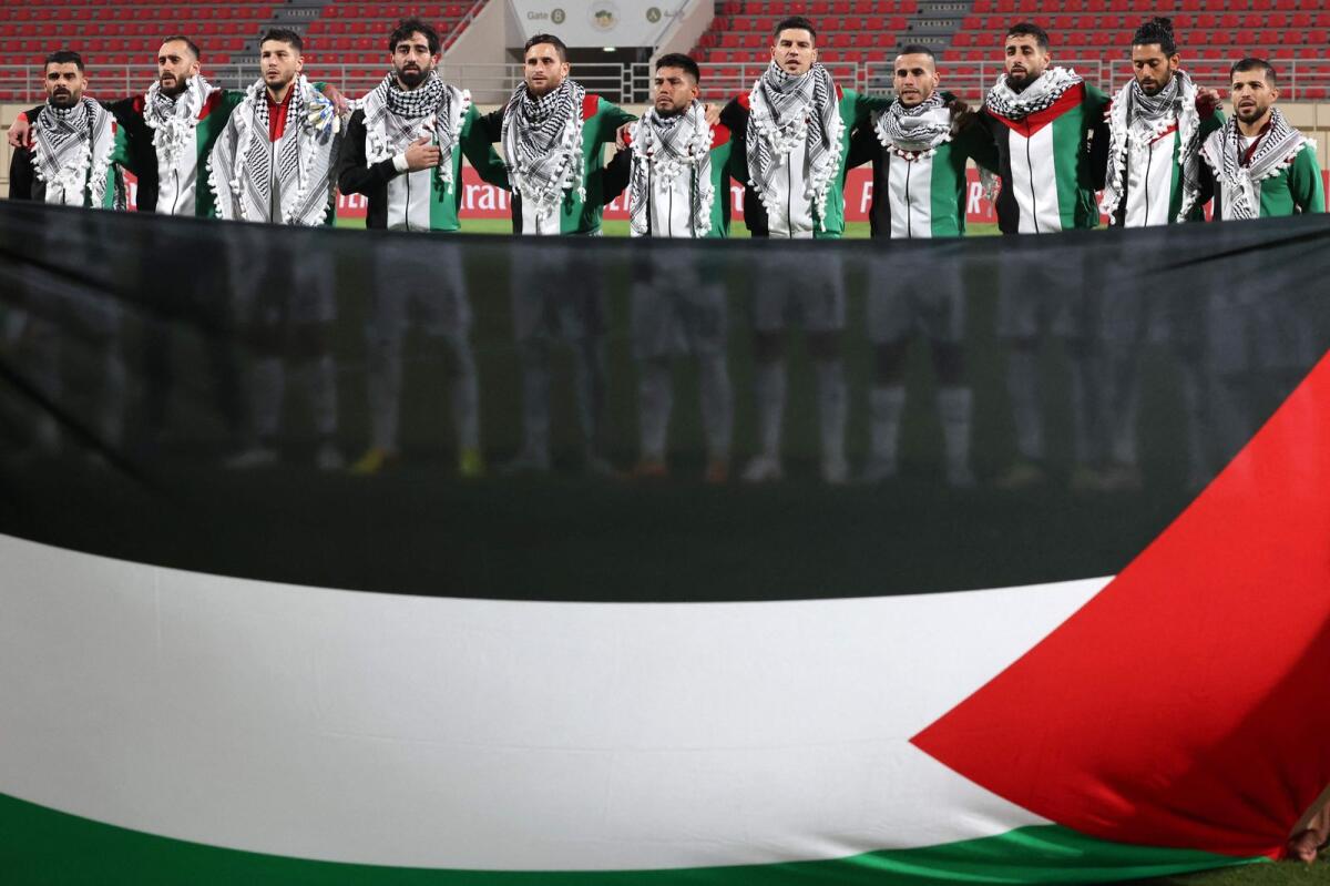 Palestine's players gather for their national anthem ahead of the 2026 Fifa World Cup qualifying match against Lebanon in Sharjah on Thursday. — AFP