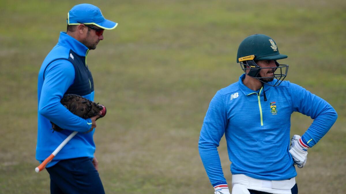 South Africa's captain Quinton de Kock (right) waits to bat during a practice session at the Rawalpindi Cricket Stadium. (AFP)