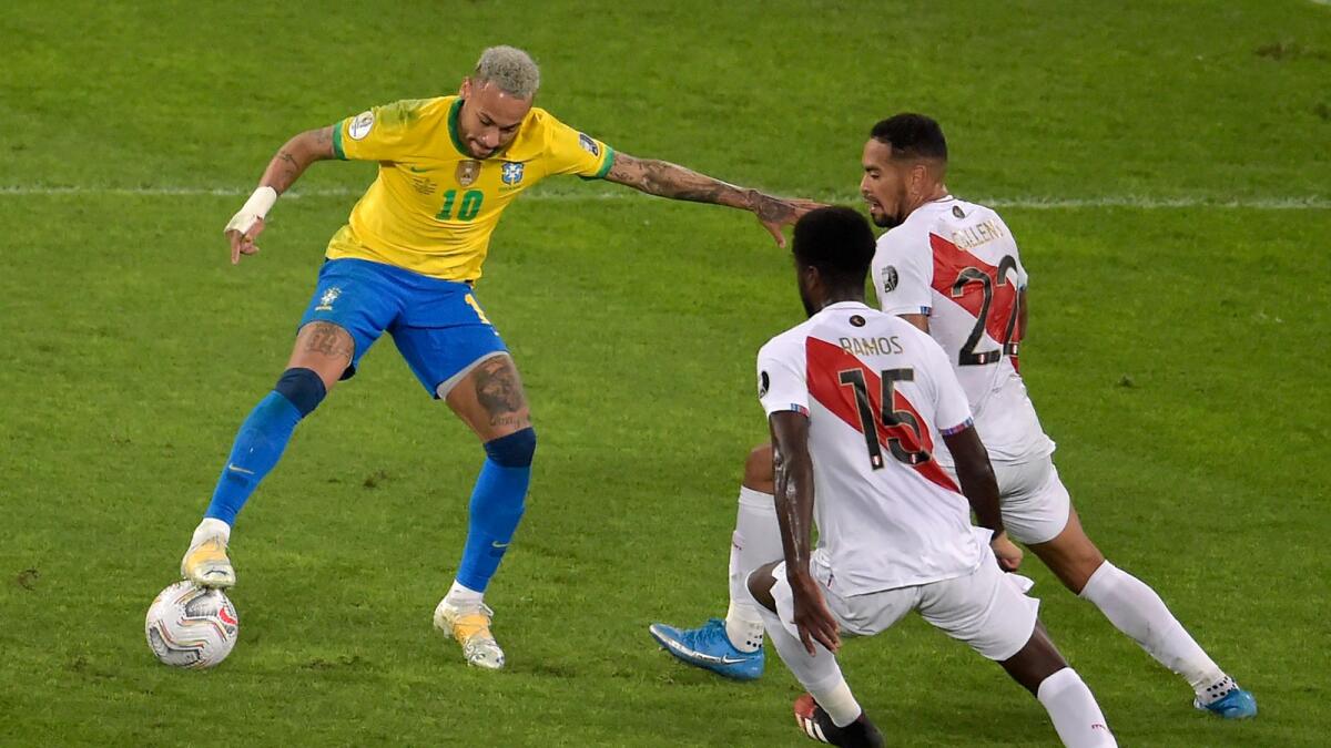 Brazil's Neymar (left) vies for the ball with Peru's Christian Ramos (centre) and Alexander Callens during the Copa America semifinal. (AFP)