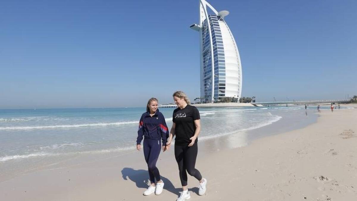 Kim Clijsters and Sofia Kenin enjoy the beautiful weather as they hit the beach near the iconic Burj Al Arab in Dubai in February. - Supplied photo
