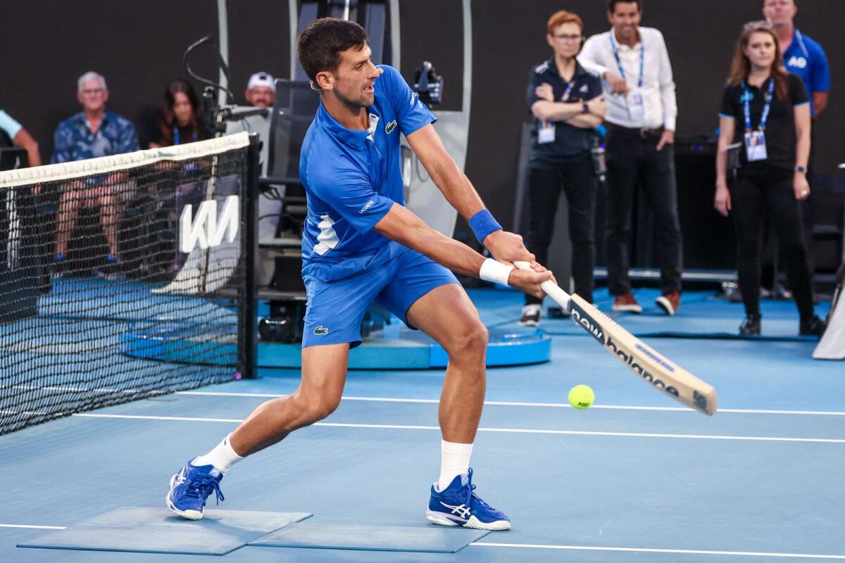 Serbia’s Novak Djokovic plays cricket during a charity event on Rod Laver Arena in Melbourne on January 11, 2024 ahead of the Australian Open tennis championship starting on January 14. - AFP