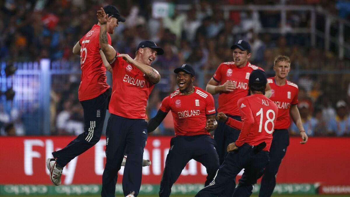 England's players celebrate the dismissal of West Indies Chris Gayle.