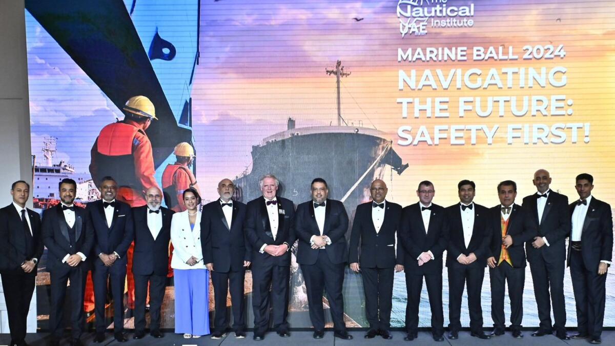 Eugene Mayne, John Lloyd, and Capt. Zarir Irani along with other participants at the annual marine ball organised by Nautical Institute UAE.