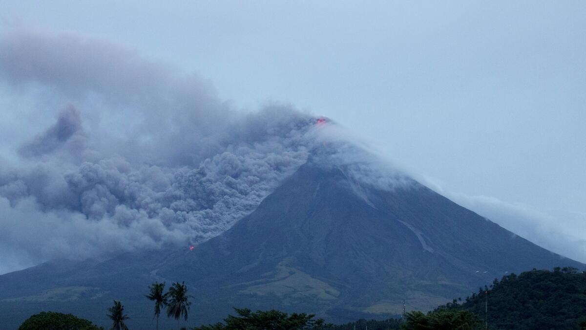 Lava continues to cascade down the slopes of Mayon volcano as seen from Legazpi city, Albay province, around 340 kilometers (210 miles) southeast of Manila, Philippines. AP
