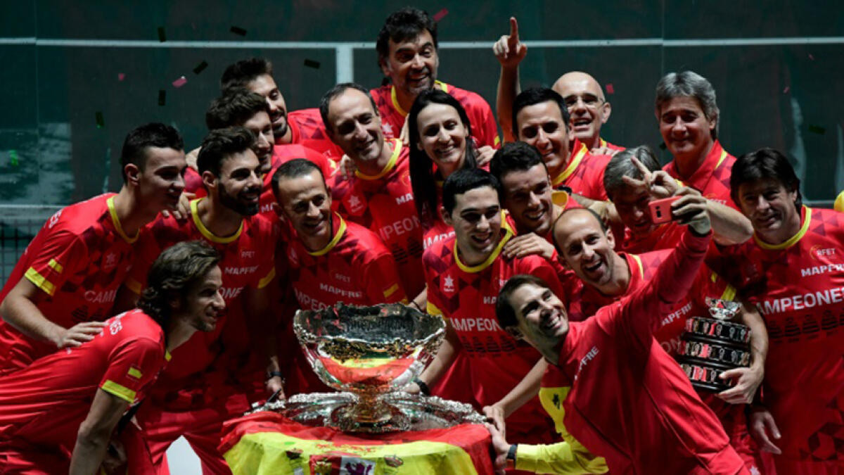 Rafael Nadal takes a selfie with teammates after Spain won the 2019 Davis Cup in Madrid. -- AFP