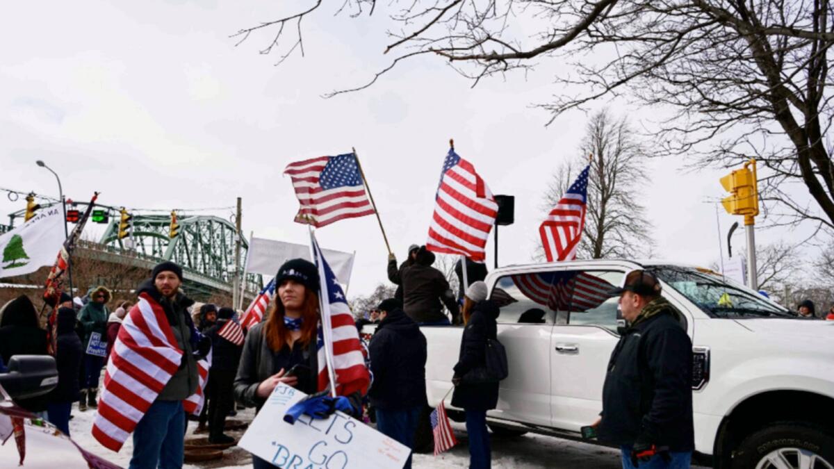 Protestors against Covid-19 vaccine mandates gather in solidarity with the Canadian trucker protest at Pat Sole Park, across from the Niagara Peace Bridge, in Buffalo, New York. — AFP