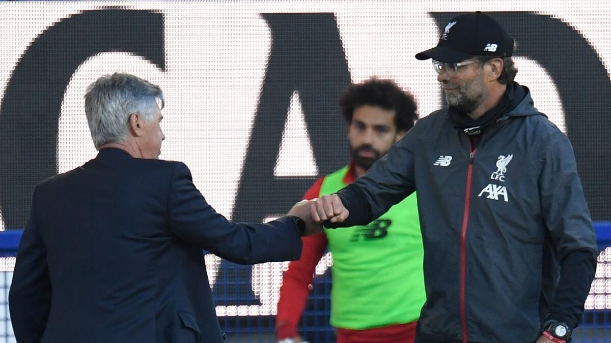 Liverpool manager Jurgen Klopp greets Everton's Italian head coach Carlo Ancelotti at the end of their Premier League match (AFP)