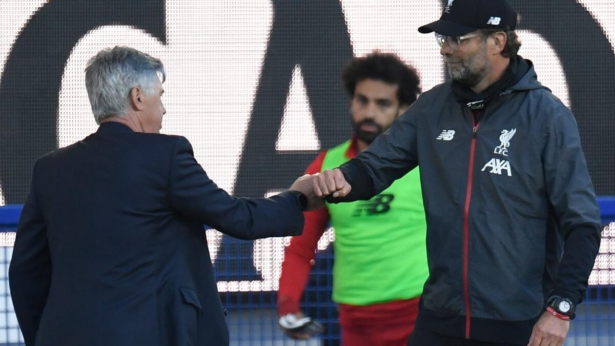 Liverpool manager Jurgen Klopp greets Everton's Italian head coach Carlo Ancelotti at the end of their Premier League match (AFP)