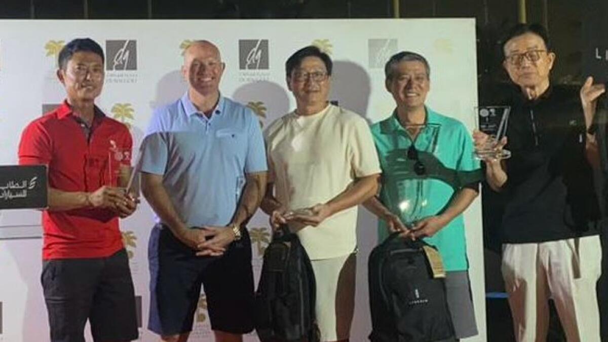 Dong Lee (left), representing EGC, with his winning team in the recent Emirates PGA Lincoln DG Pro-Am at Emirates Golf Club.- Supplied photo