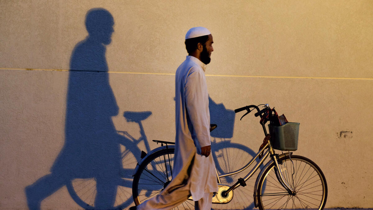 A faithful parks his cycle to attend Maghrib prayers at a mosque in Dubai. Photo by Shihab/Khaleej Times