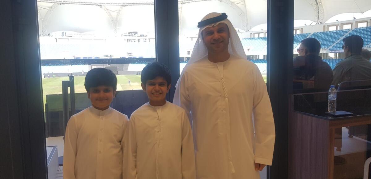 Zayed Abbas with his sons Mansoor and Khalifa during the Under 19 Asia Cup final in Dubai. — Photo by Rituraj Borkakoty