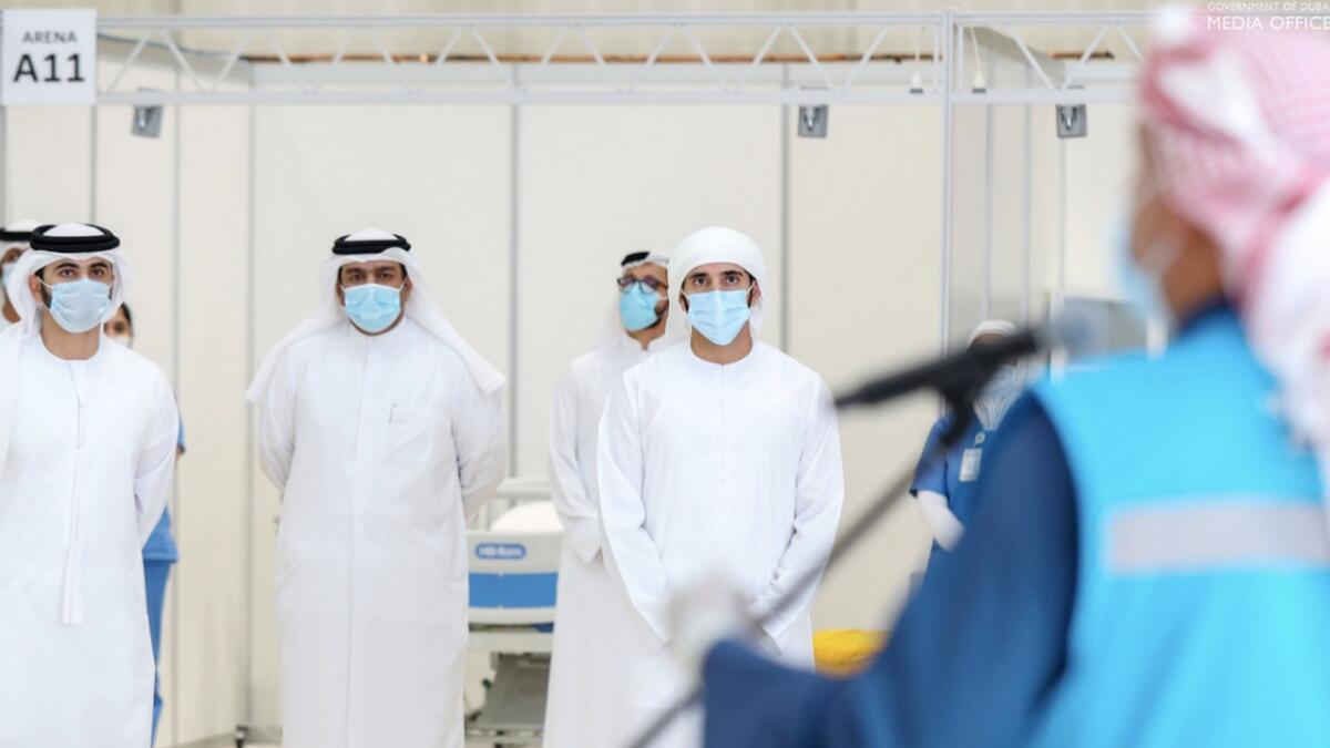 A series of photos shared on social media by the Government of Dubai Media Office on Saturday show Sheikh Hamdan adhering to precautions like wearing a mask and gloves as he tours the field hospital. He is also seen interacting with the medics at the facility as he maintains an adequate social distance from them.