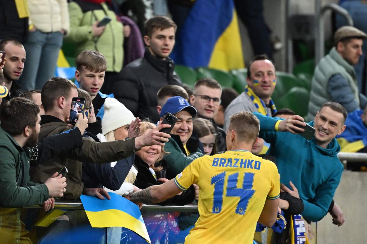 Ukraine's Volodymyr Brazhko celebrates with fans. — AFP