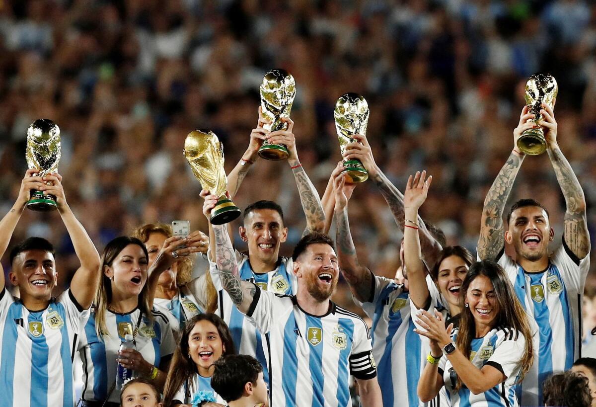 Lionel Messi and teammates celebrate with their families. — Reuters