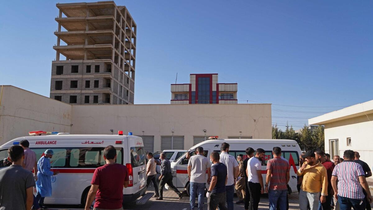 People gather outside a hospital following the shelling in the city of Zakho in Iraq's  Kurdish region. – AFP