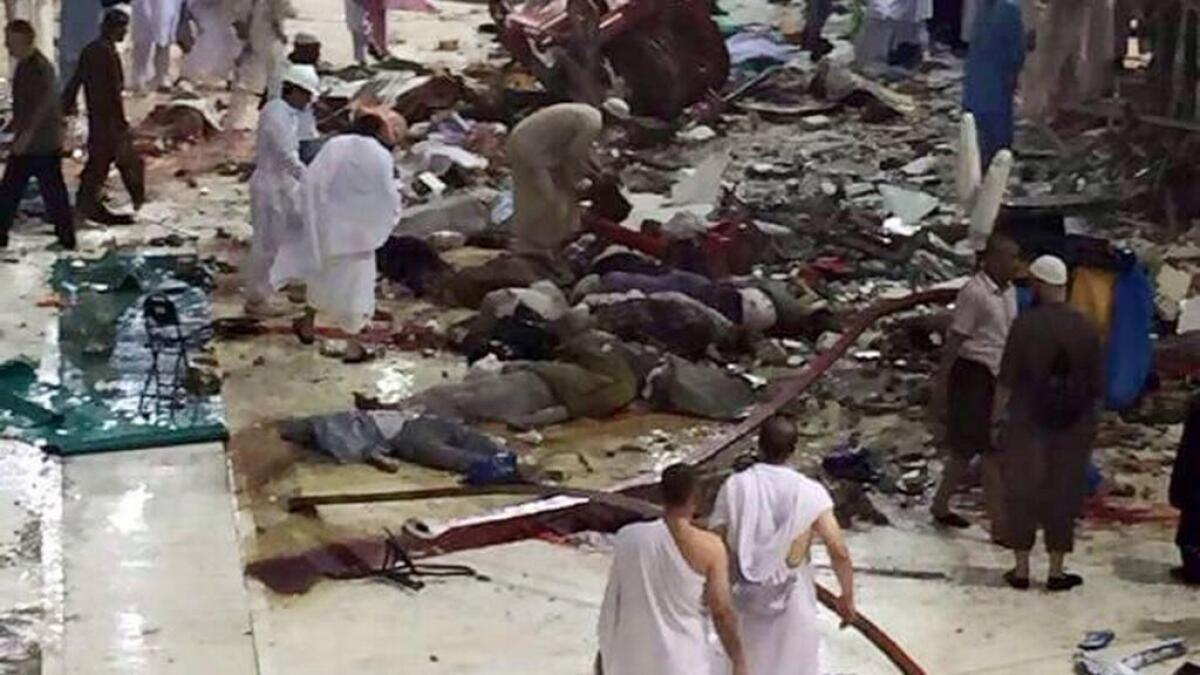 Pilgrims and first responders gather at the site of a crane collapse that killed dozens inside the Grand Mosque in the Holy City of Makkah, Saudi Arabia. File photo
