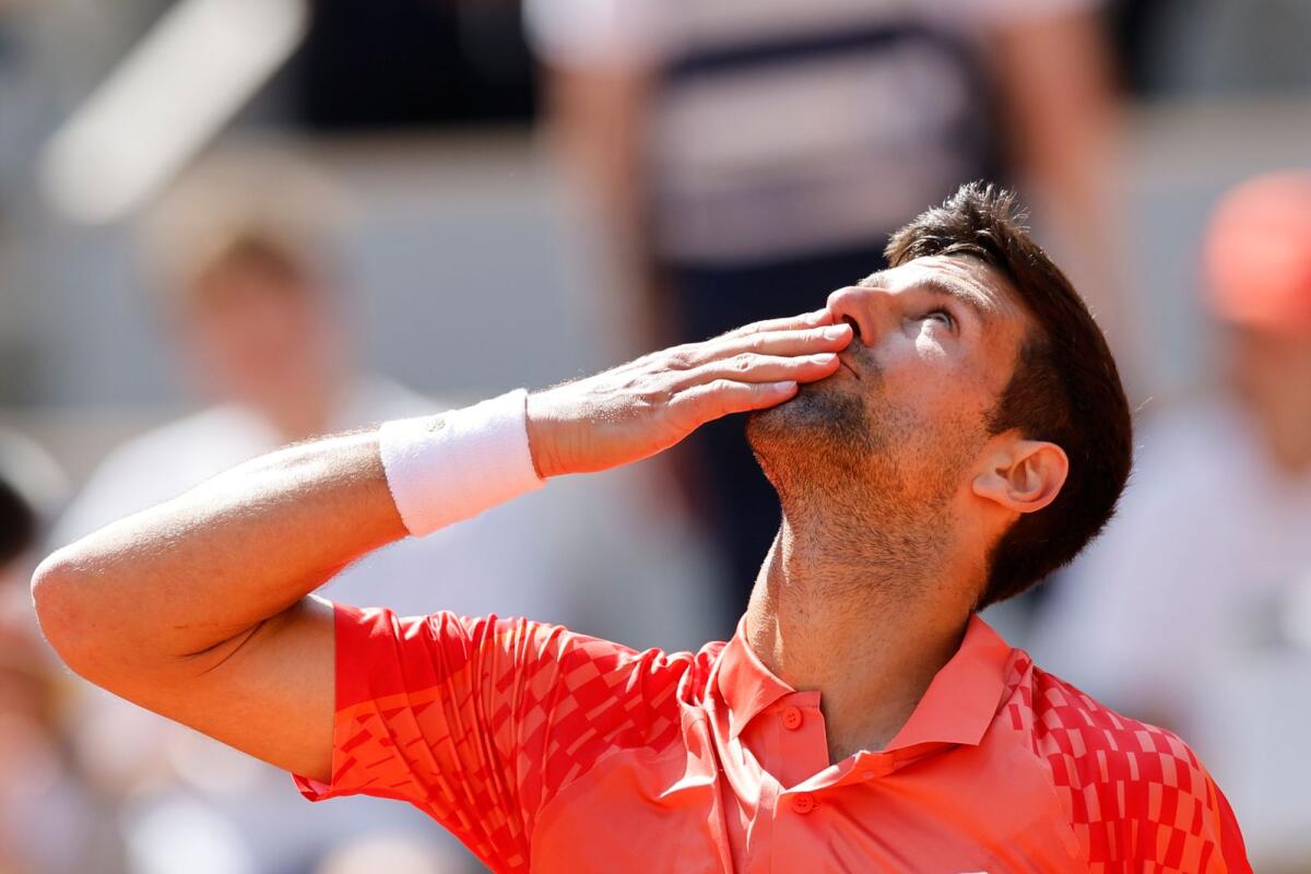 Serbia's Novak Djokovic celebrates after winning the first round match at the French Open. — AP