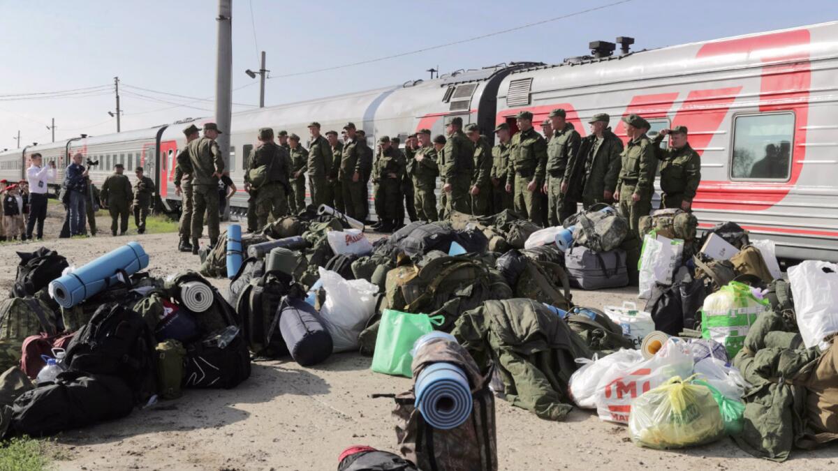 Russian recruits gather to take a train at a railway station in Prudboi, Volgograd region of Russia. — AP file