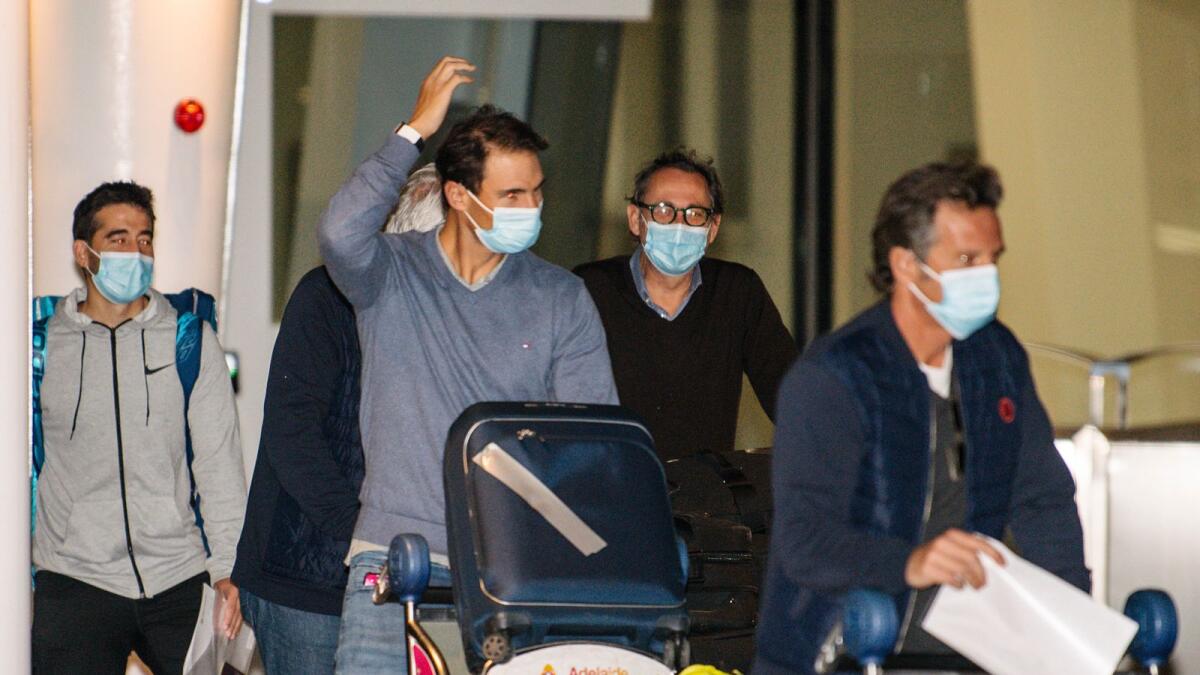 Spain's Rafael Nadal (centre) arrives at Adelaide Airport ahead of the Australian Open tennis championship. — AP
