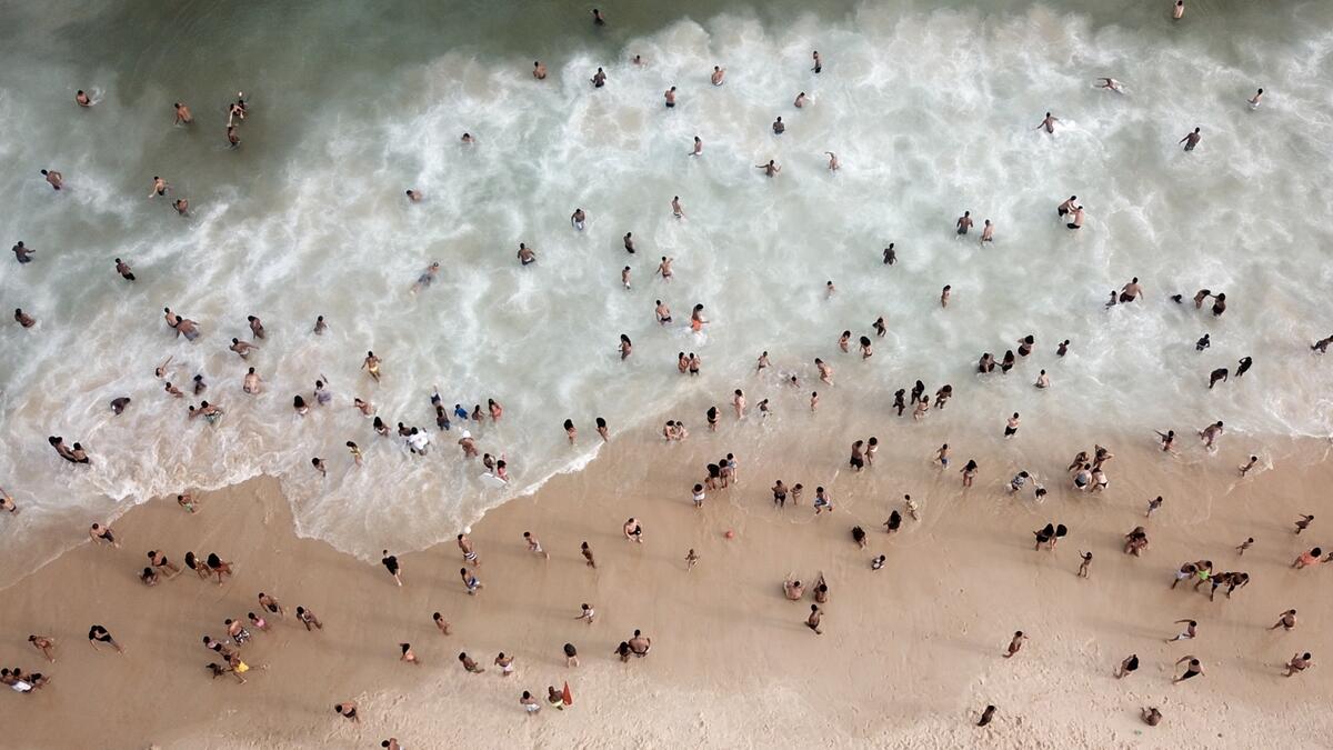 People enjoy at Ipanema beach, amid the coronavirus disease (Covid-19) outbreak, in Rio de Janeiro, Brazil. Photo: Reuters