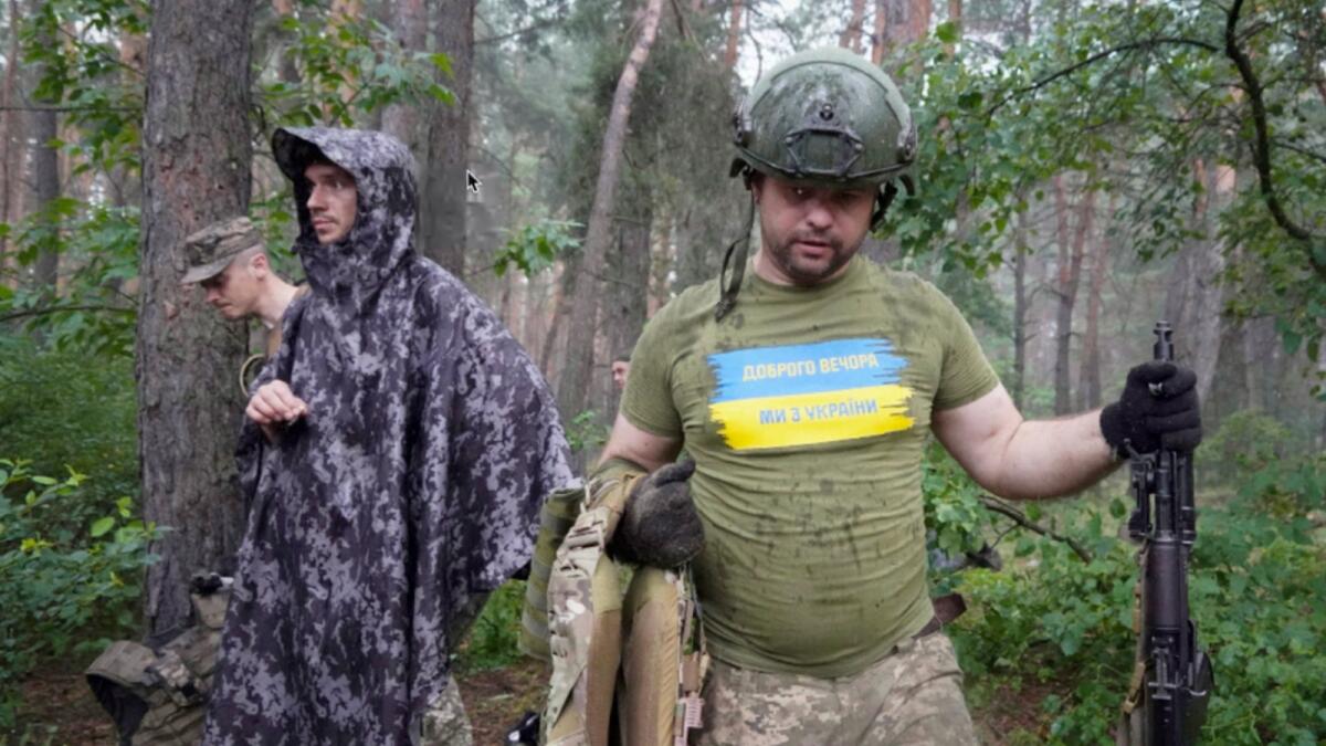 Ukrainian servicemen take their position near the frontline in Kharkiv region. — AP