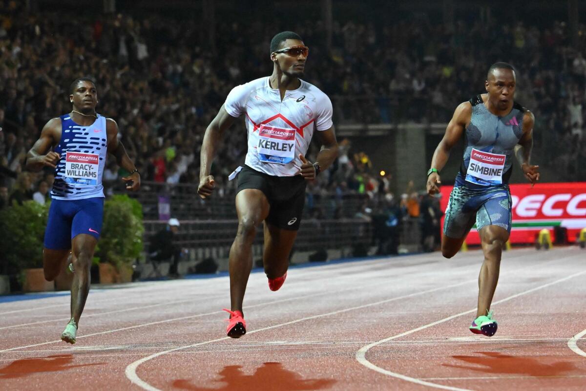 USA's Fred Kerley (C) crosses the finish line to win the Men's 100m event of the Wanda Diamond League 2023 Golden Gala. - AFP