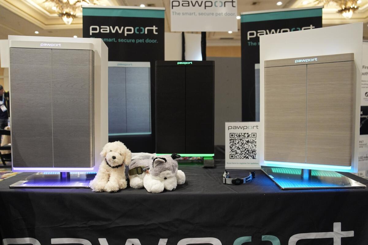 The Pawport pet door is on display at the Pawport booth at Pepcom ahead of the CES tech show on Monday in Las Vegas. The pet door utilizes a tag attached to a pet's collar to signal the door to open. — AP