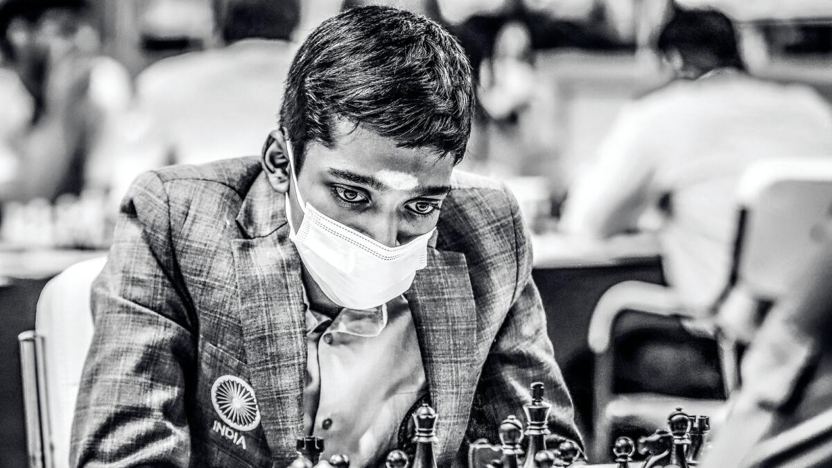 **EDS: FILE IMAGE** Chennai: In this Saturday, July 30, 2022 file photo grandmaster Rameshbabu Praggnanandhaa plays in the 44th Chess Olympiad at Mamallapuram near Chennai. Praggnanandhaa stunned five-time World Chess Champion Magnus Carlsen at the FTX Crypto Cup and finished runners-up in the tournament in Miami, US. (PTI Photo)  (PTI08_22_2022_000043B)