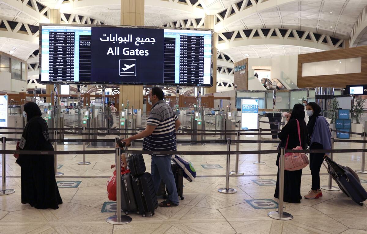 Saudi passengers arrive to King Khaled International airport in the capital Riyadh on May 17, 2021. Photo: AFP