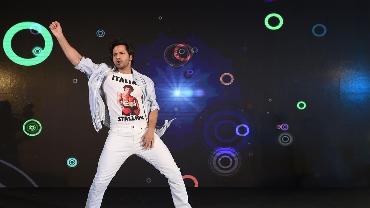 Bollywood actor Varun Dhawan performs before fans at a mall on the sidelines of the 19th International Indian Film Academy (IIFA) festival in Bangkok.- AFP
