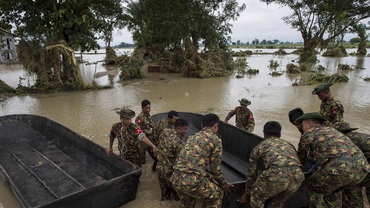 Rescuers struggle to reach stranded in Myanmar dam flooding