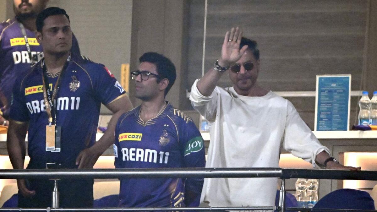 Bollywood actor and owner of the IPL team Kolkata Knight Riders Shah Rukh Khan greets his supporters during the Indian Premier League  match between Kolkata Knight Riders and Sunrisers Hyderabad at the Eden Gardens in Kolkata. - AFP