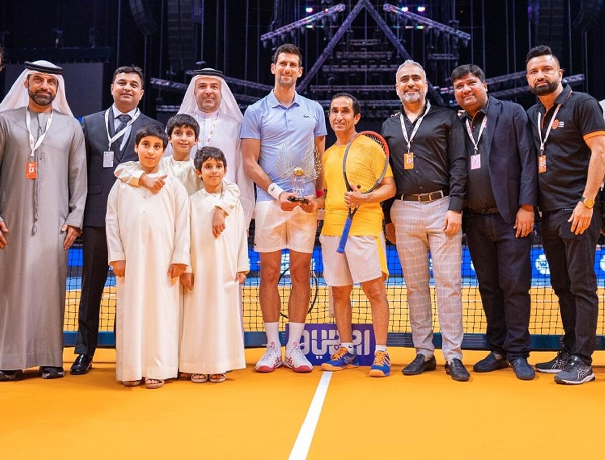 Sheikh Saeed bin Maktoum bin Juma Al Maktoum (fourth from right) with Novak Djokovic. — Supplied photo