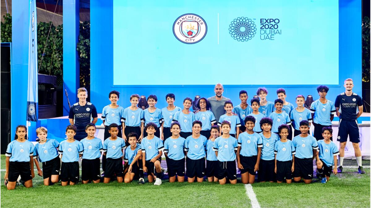 Pep Guardiola with City Football Schools' students. (Supplied photo)