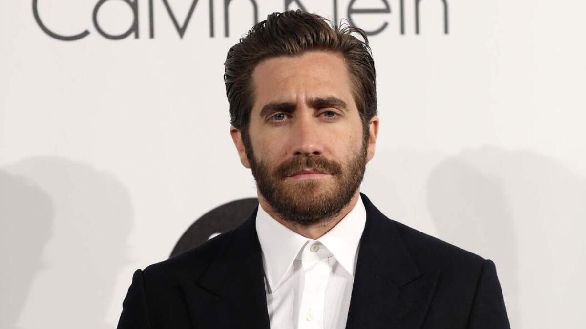 Jury member and actor Jake Gyllenhaal poses for photographers upon arrival at the Calvin Klein Women in Film party at the 68th international film festival.