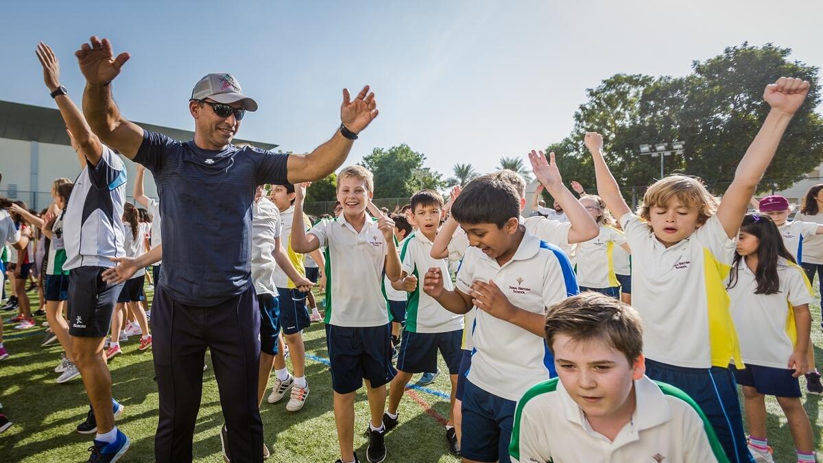 Dr Abdulla Al Karam, director-general of the KHDA along with students of Dubai British School participating in the The Daily Mile run.-Photo by Neeraj Murali