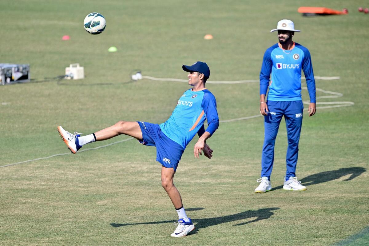 India's Shubman Gill (left) plays football during a practice session in Chattogram. — AFP
